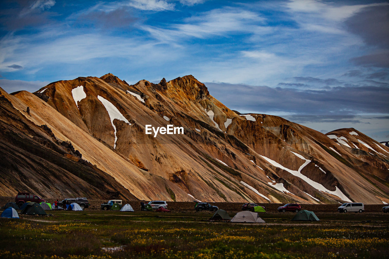 Scenic view of mountain against cloudy sky