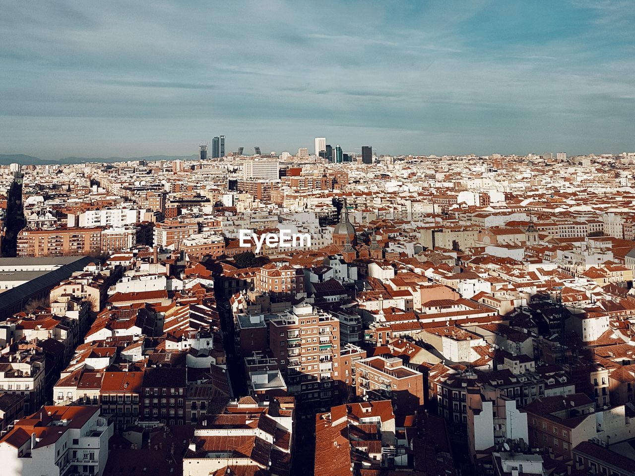 HIGH ANGLE VIEW OF CITY AGAINST SKY