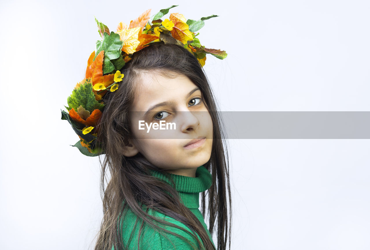 Portrait of a seven year old girl on a white background