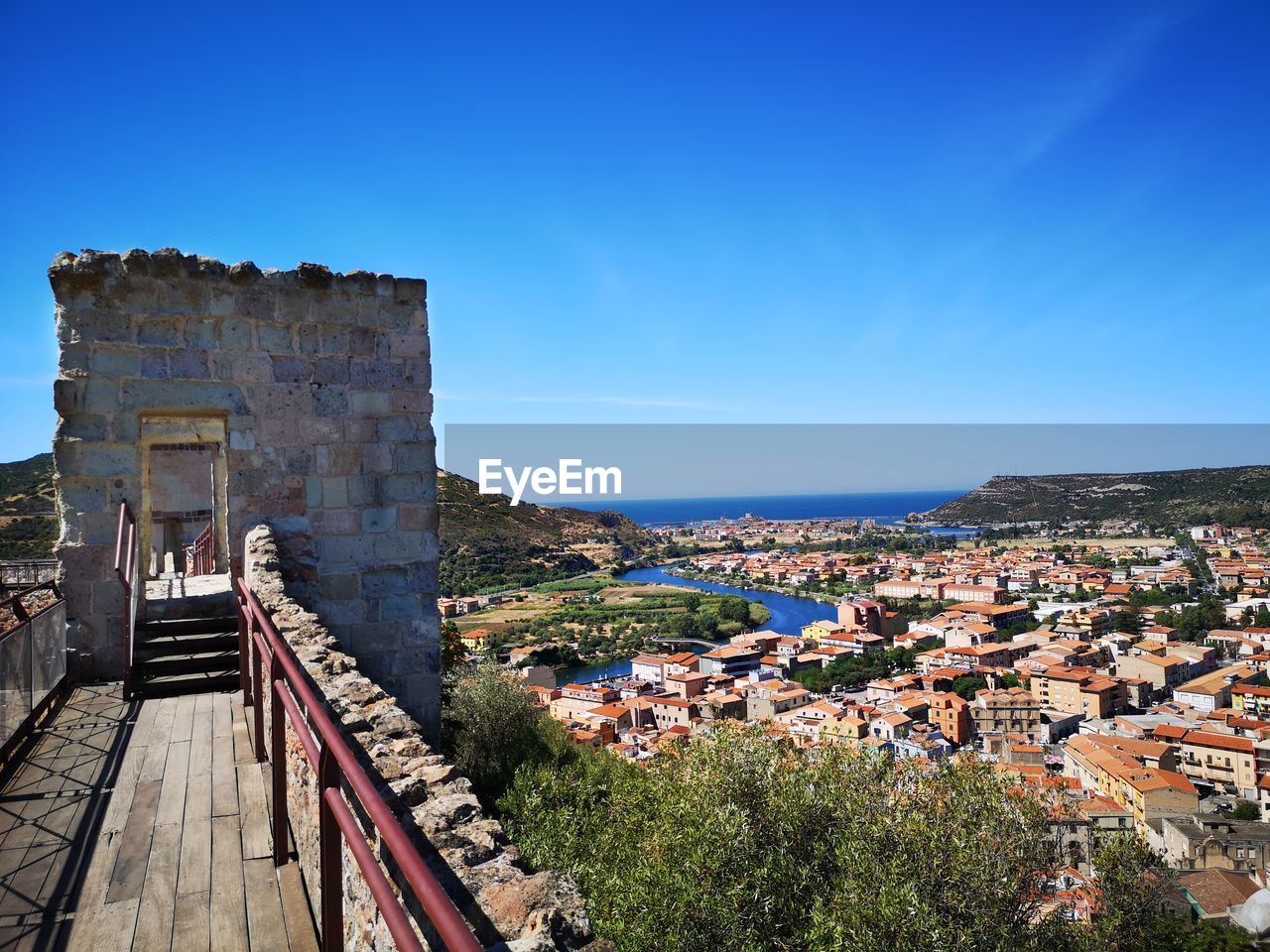 architecture, built structure, building exterior, sky, cityscape, city, building, nature, vacation, town, travel destinations, blue, landmark, history, tourism, the past, travel, clear sky, residential district, urban area, sea, water, outdoors, no people, high angle view, day, old, house, sunny, land, landscape