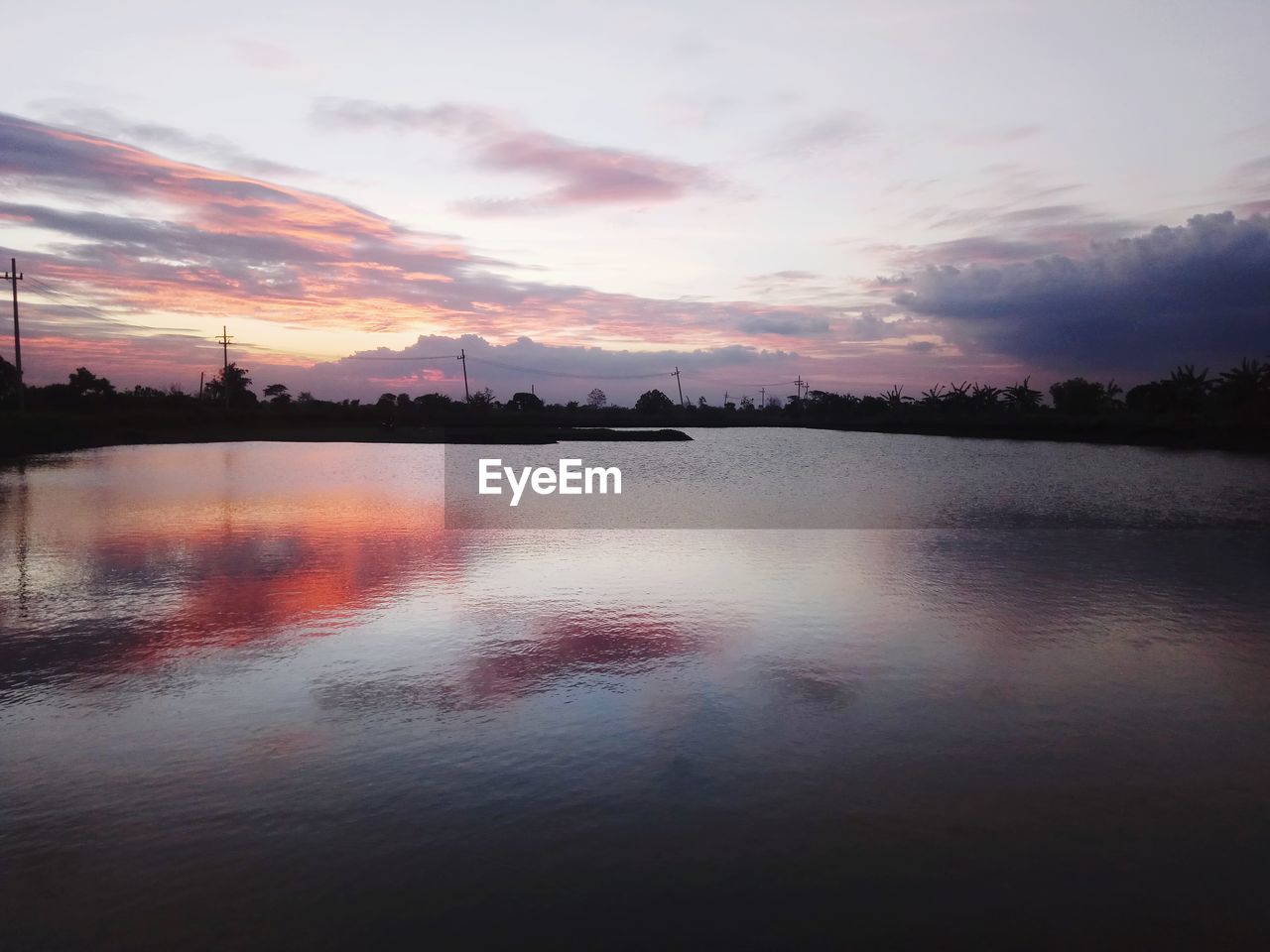 SCENIC VIEW OF LAKE DURING SUNSET
