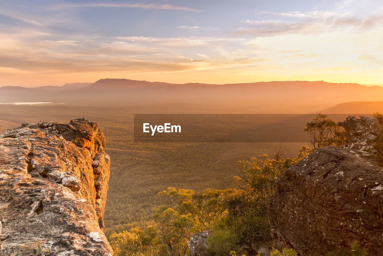 Scenic view of mountains against sky during sunset