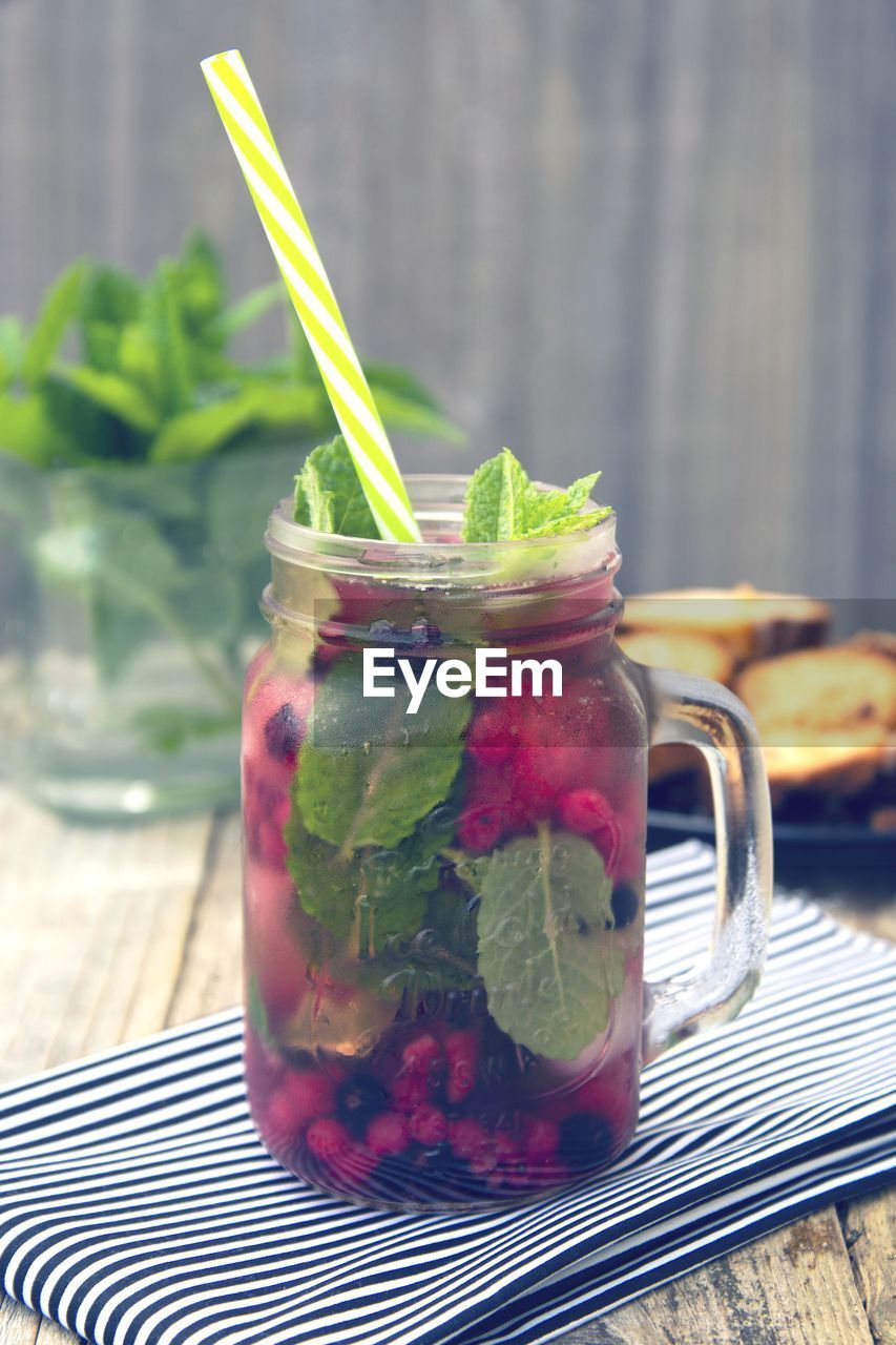 CLOSE-UP OF JUICE WITH DRINK IN GLASS