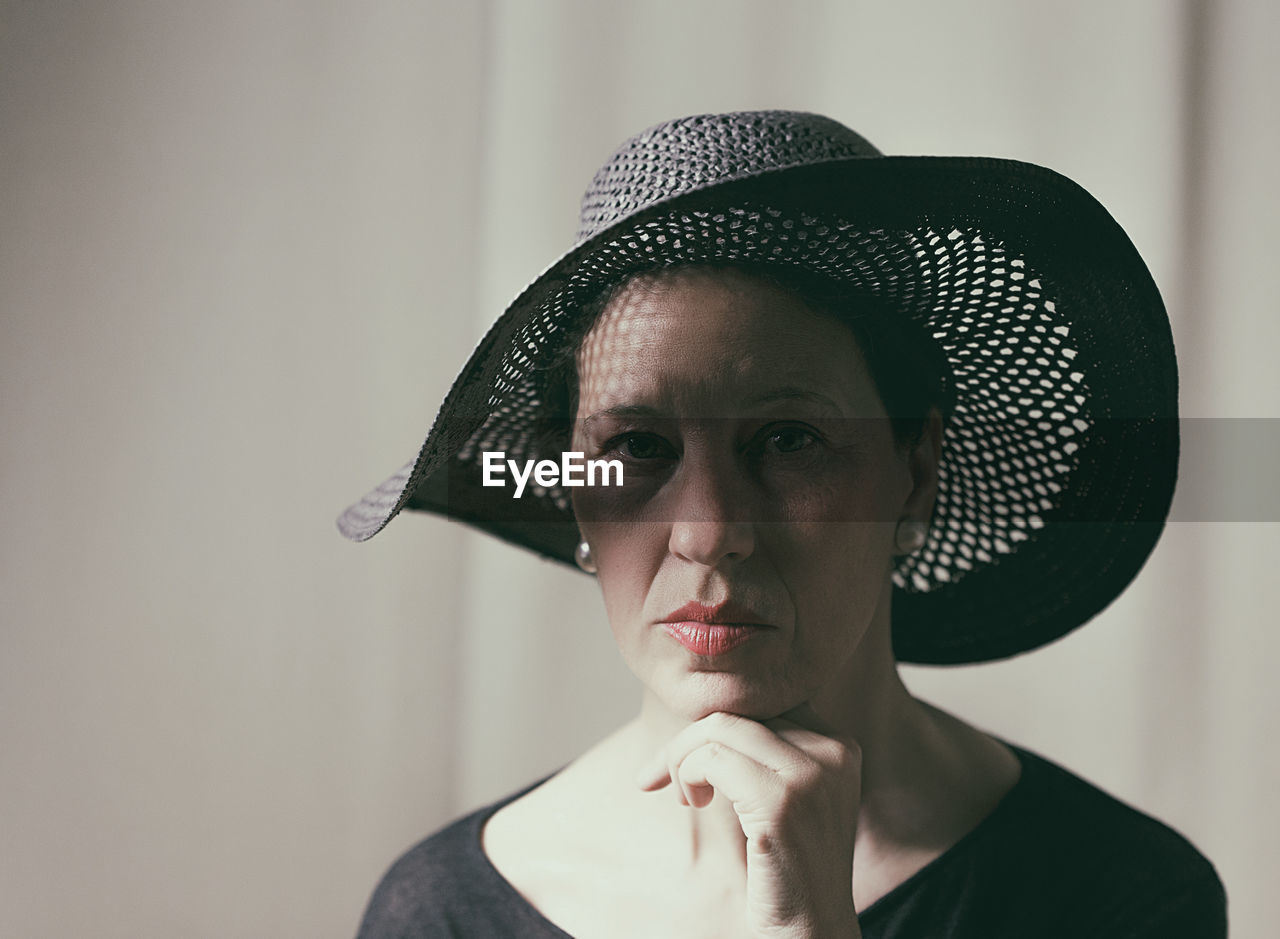 Portrait of mature woman wearing hat