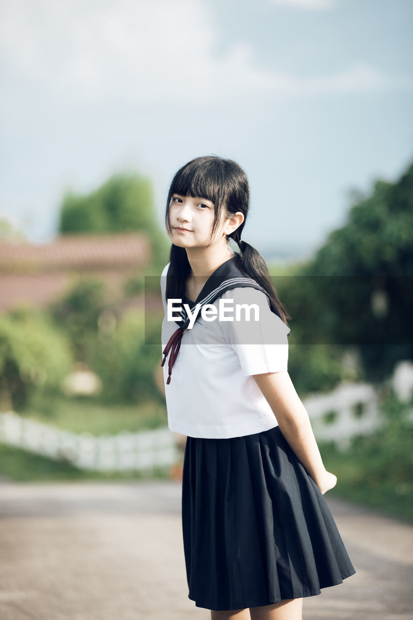 Portrait of girl standing outdoors