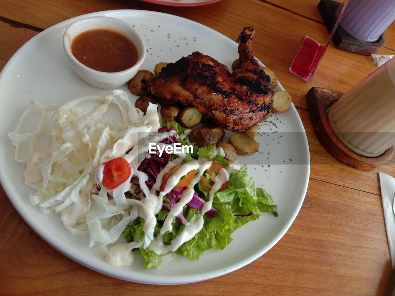 food and drink, food, table, meat, healthy eating, vegetable, plate, lunch, dish, meal, freshness, indoors, wellbeing, high angle view, salad, fast food, no people, cuisine, serving size, still life, chicken meat, restaurant, bowl, wood, breakfast, chicken, condiment, sauce, close-up