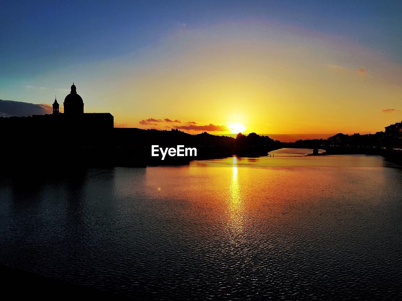 SCENIC VIEW OF SUNSET SKY OVER SILHOUETTE WATER