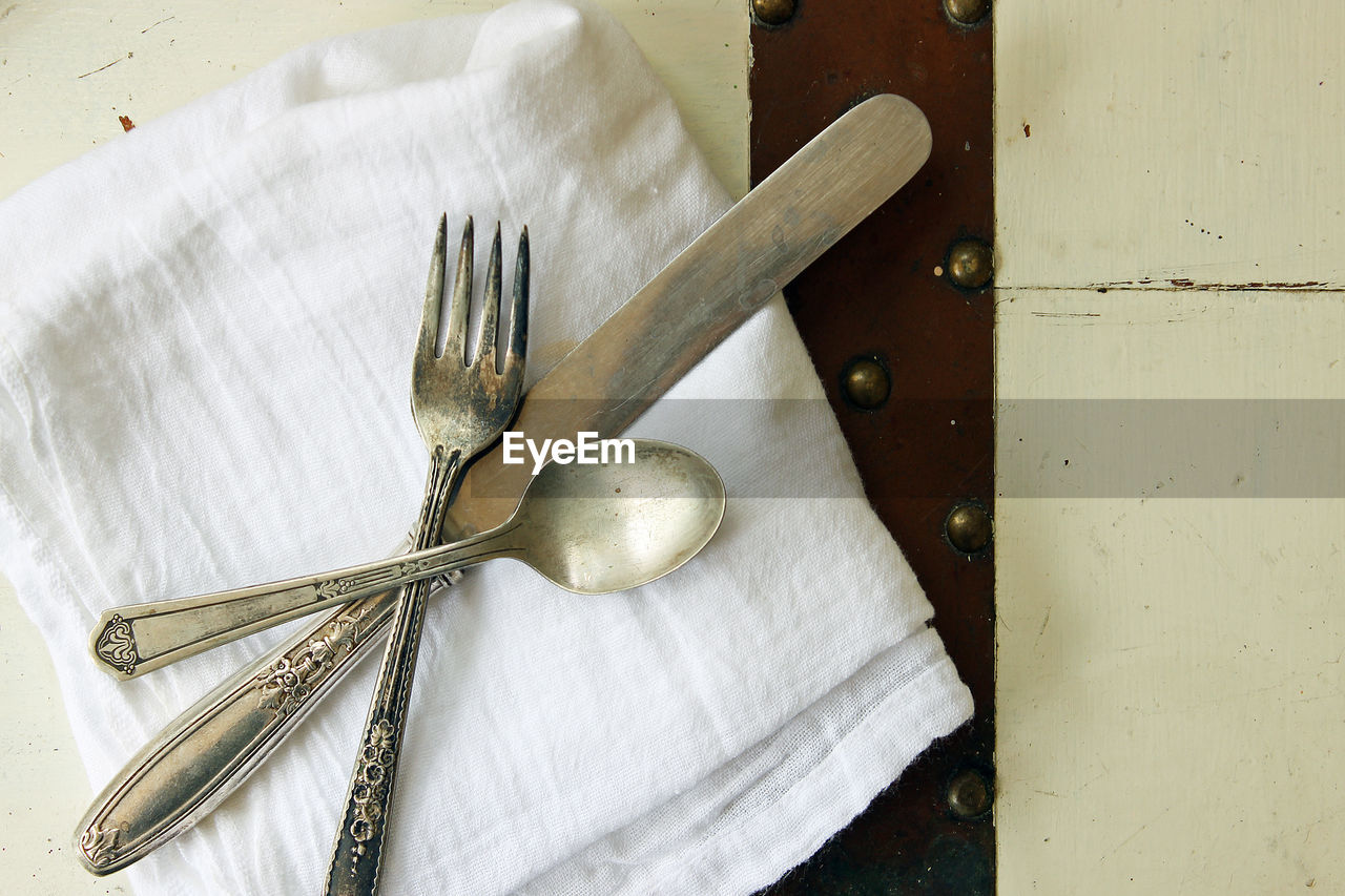 High angle view of eating utensil on table