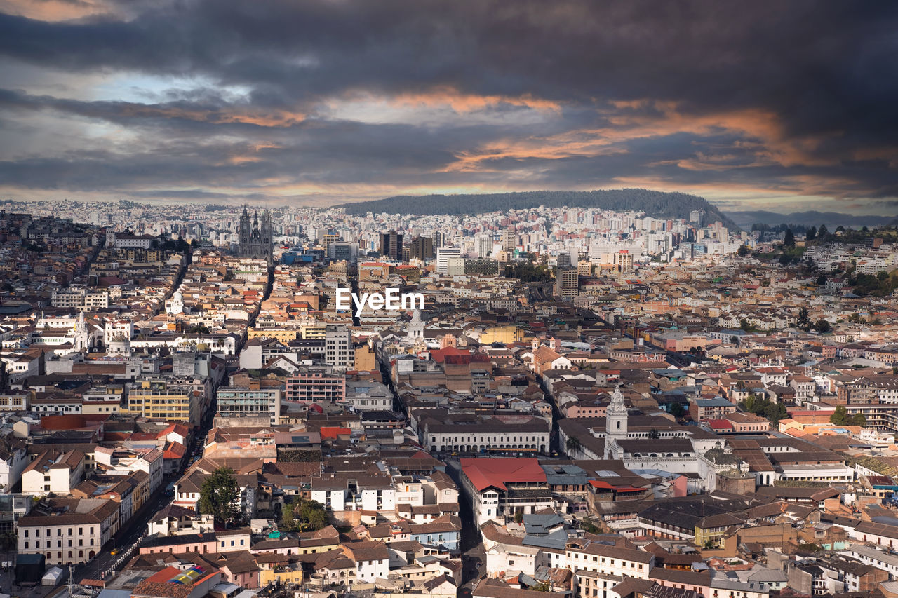 High angle panoramic view of the city of quito at sunset.