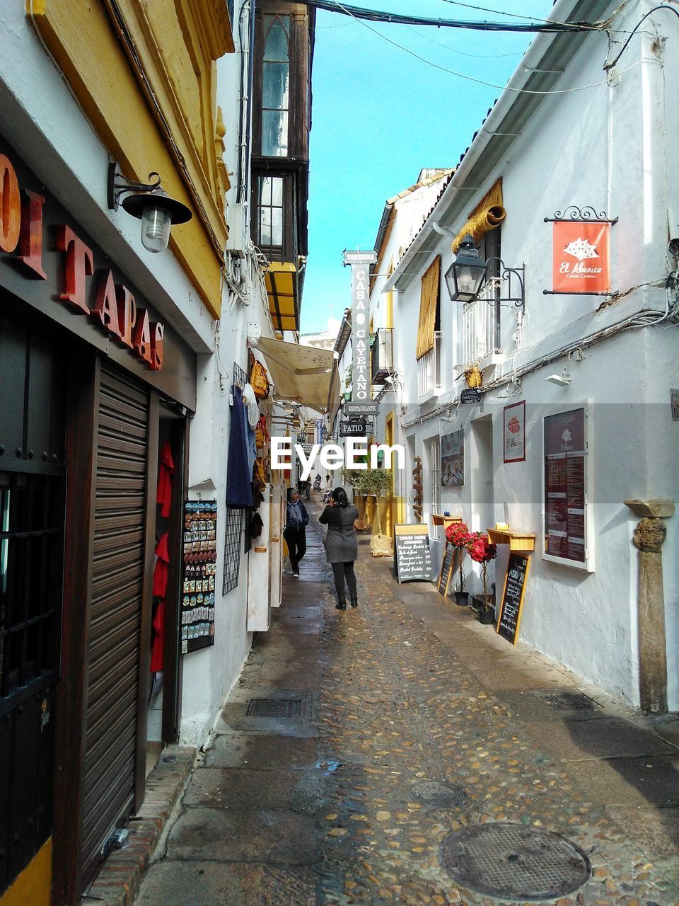 PEOPLE WALKING ON STREET IN CITY