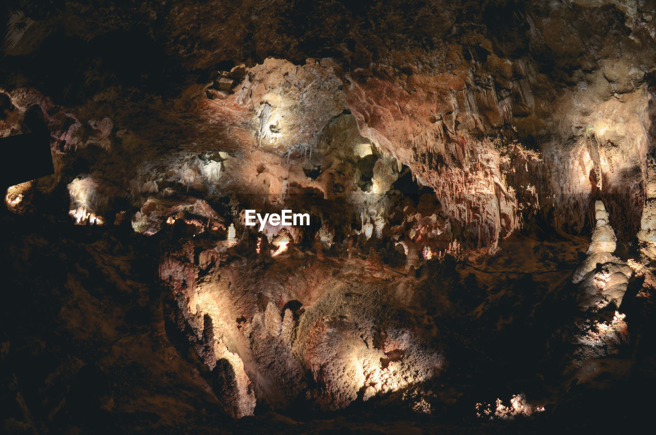 CLOSE-UP OF CAVE ON ROCK