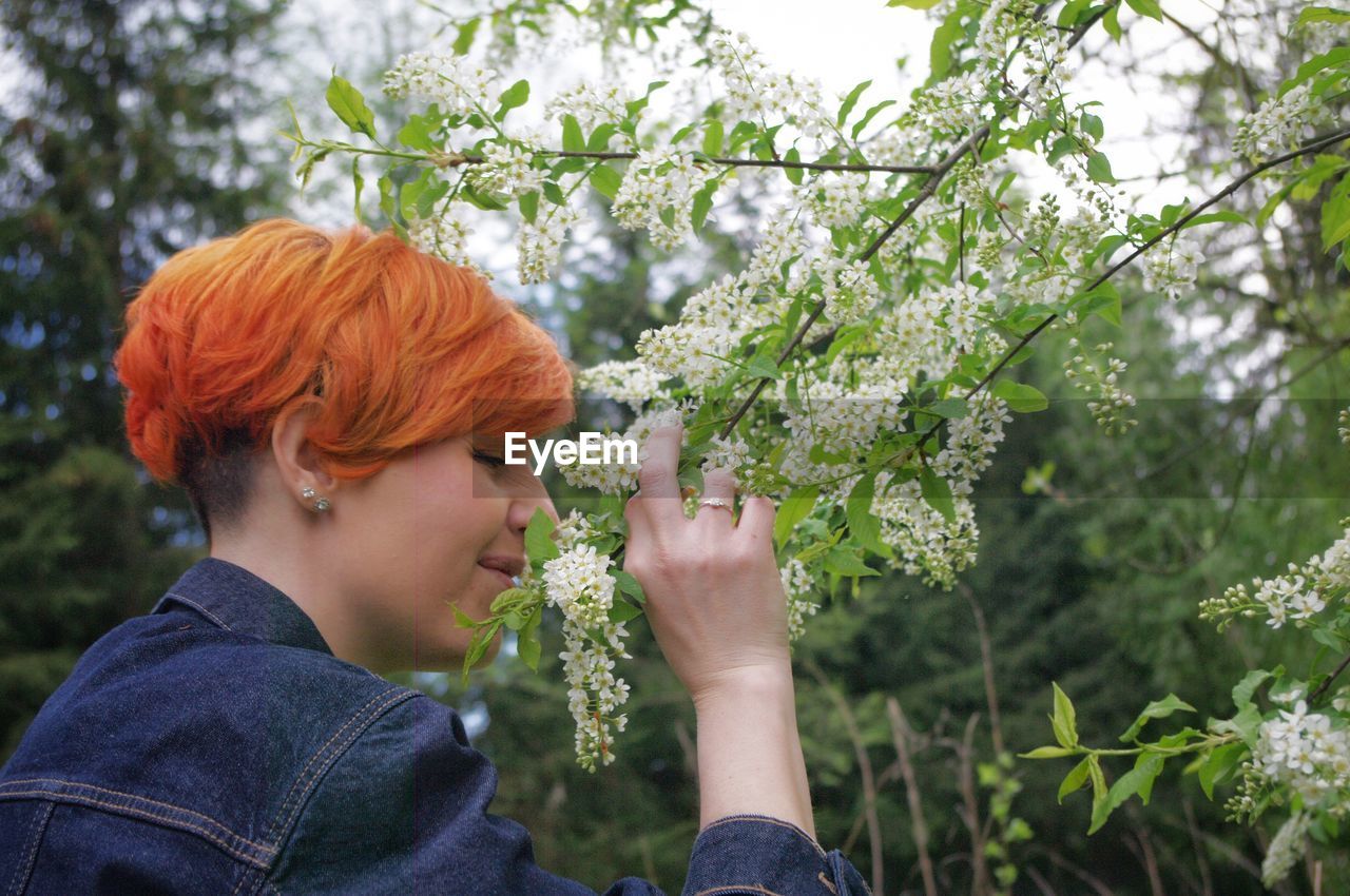 Side view of women against plants and trees