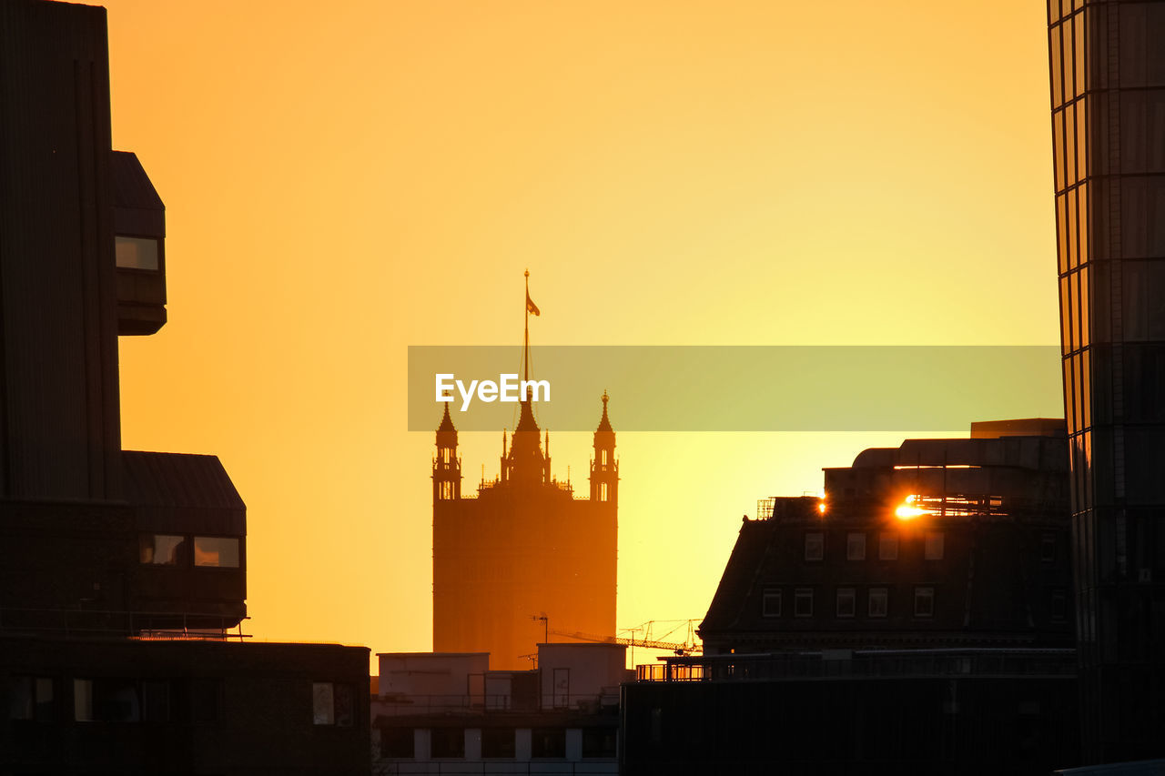 SILHOUETTE OF BUILDINGS AT SUNSET