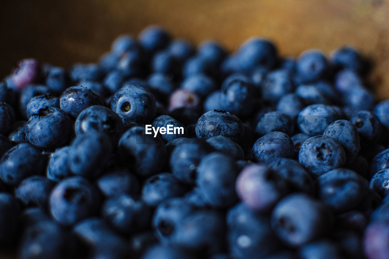 Close up of blueberries in a wooden bowl