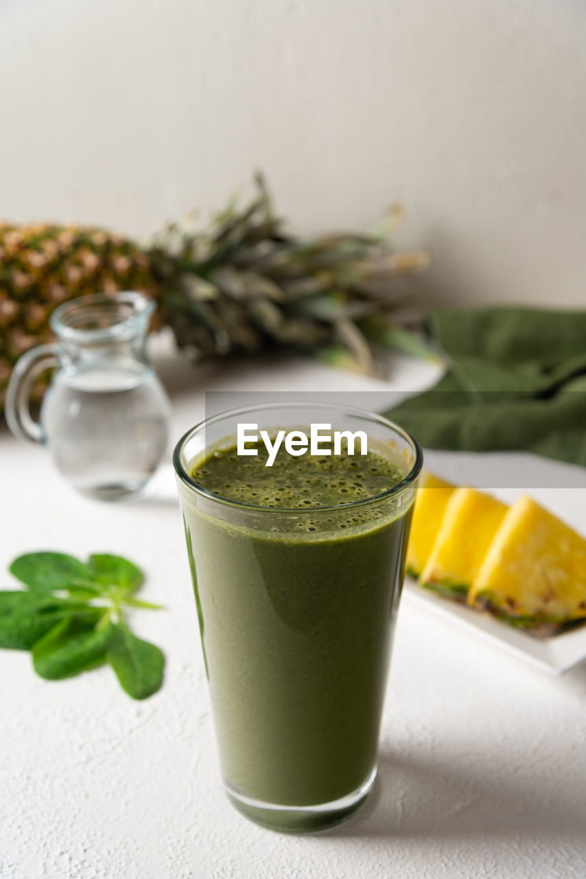 food and drink, food, healthy eating, drink, wellbeing, refreshment, herb, glass, freshness, drinking glass, household equipment, green, fruit, soft drink, studio shot, indoors, vegetable, smoothie, produce, no people, spinach, plant, leaf, spice, juice, plant part, green sauce, crockery, still life