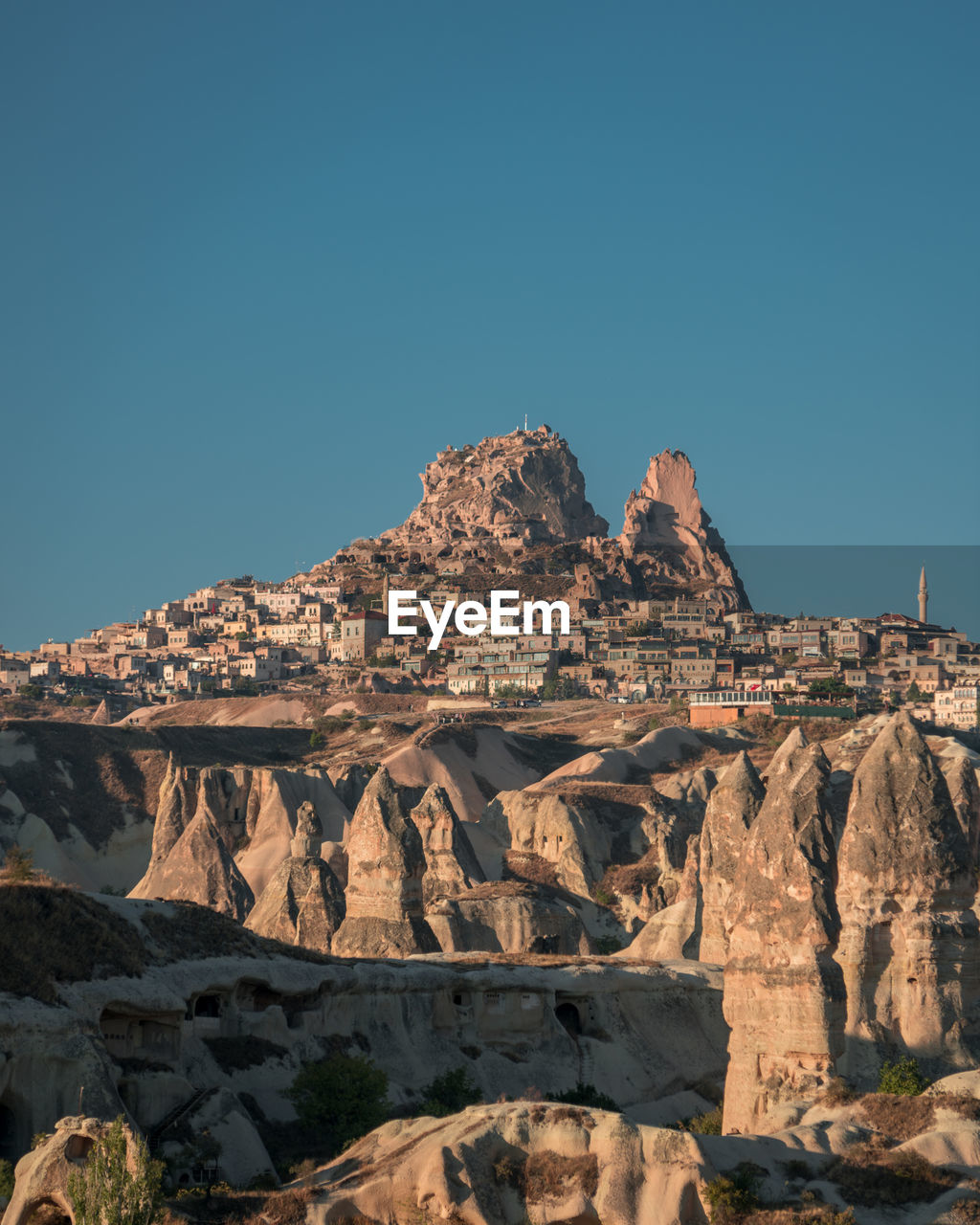 View of rock formations against blue sky