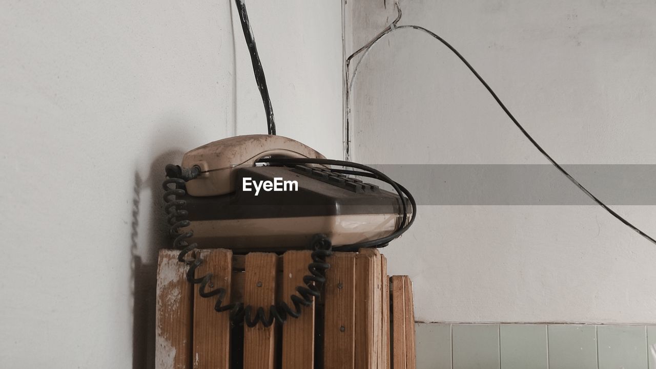 Close-up of old telephone in abandoned building