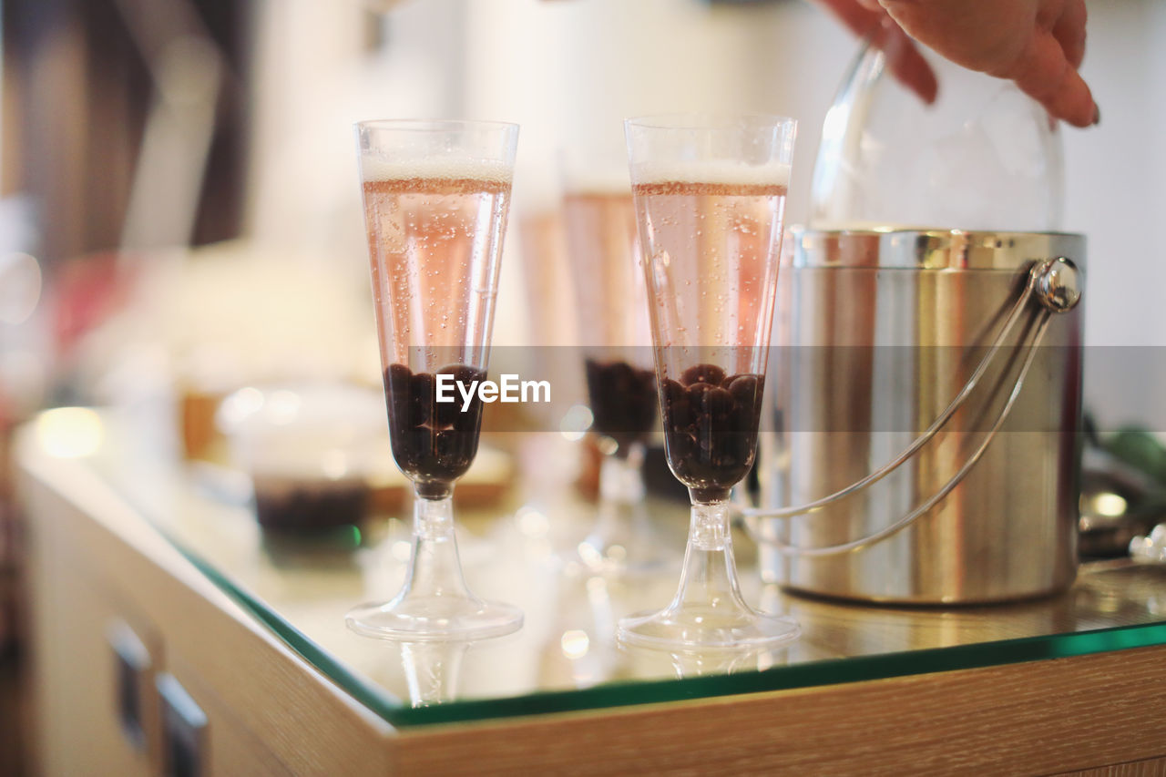 CLOSE-UP OF WINEGLASS ON TABLE