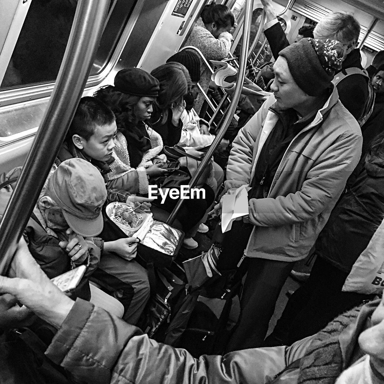 GROUP OF PEOPLE ON TRAIN