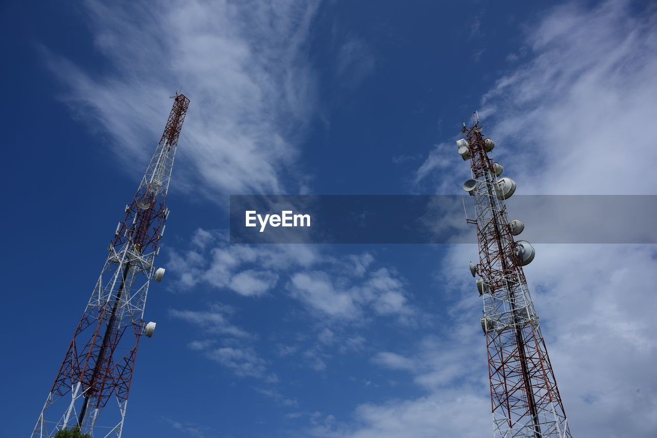 sky, technology, broadcasting, communications tower, communication, global communications, wireless technology, cloud, low angle view, telecommunications engineering, tower, satellite dish, blue, architecture, satellite, built structure, nature, telecommunications equipment, electricity, overhead power line, metal, antenna, industry, no people, outdoors, day, radio, spire, transmission tower, mast, machinery, construction industry, crane - construction machinery, equipment, television industry, vehicle, steel