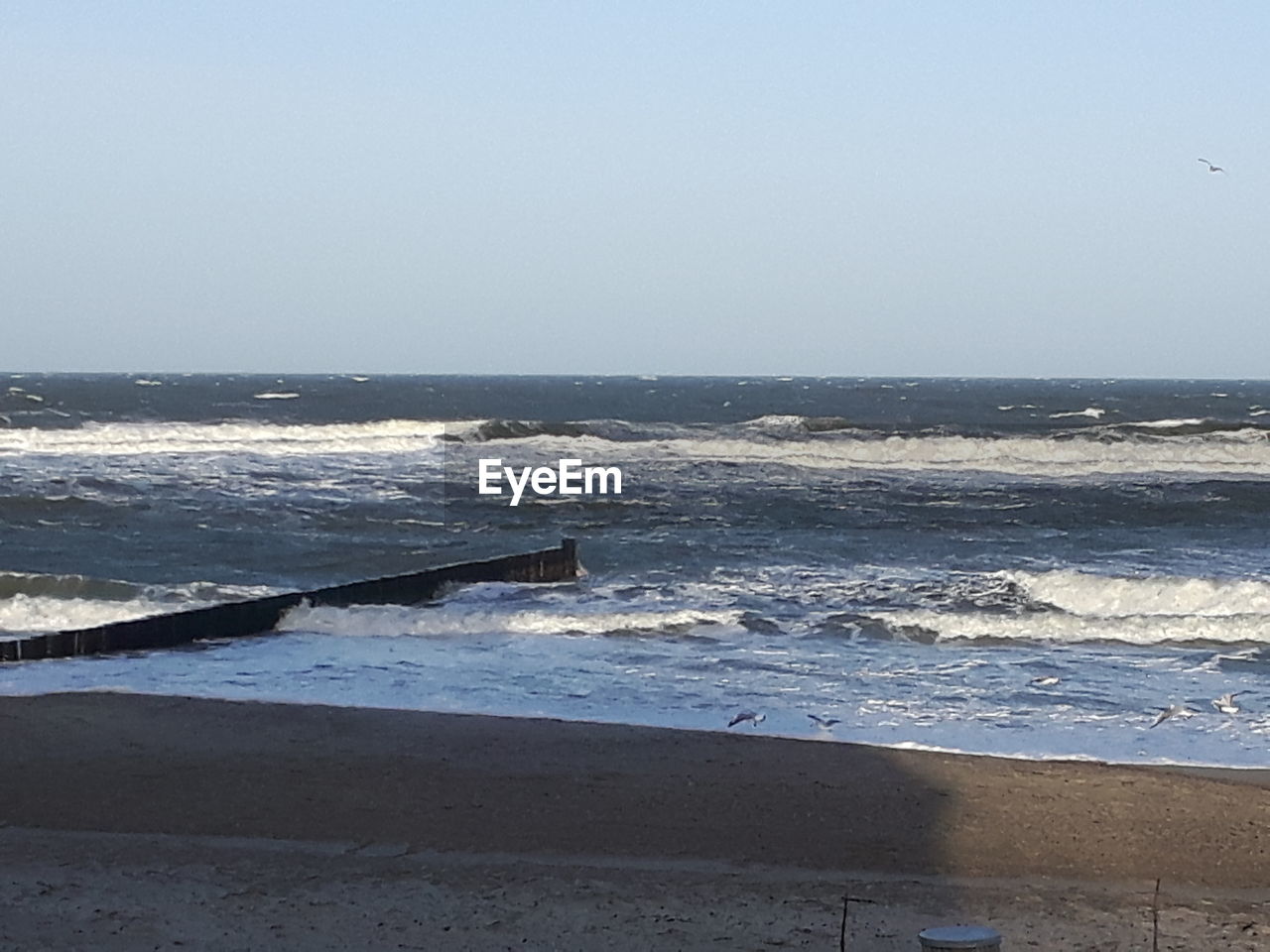 SCENIC VIEW OF BEACH BY SEA AGAINST SKY