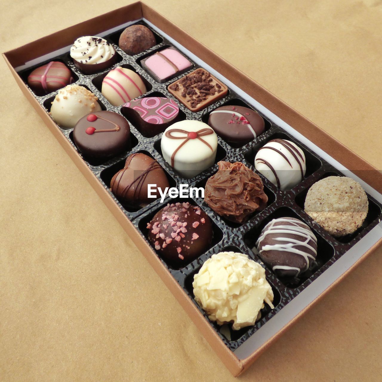 High angle view of various chocolates in box