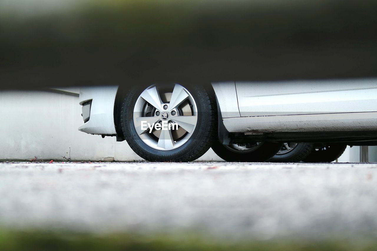 Cropped image of car parked on street