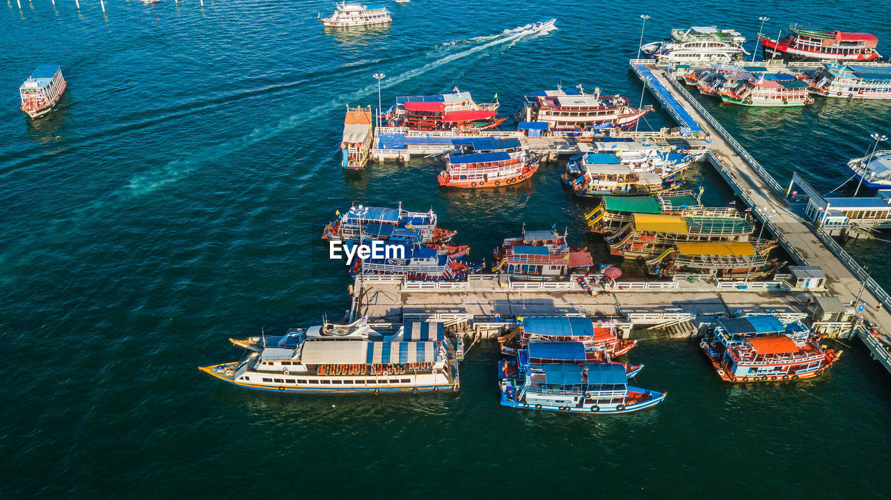 HIGH ANGLE VIEW OF SHIP MOORED AT SEA