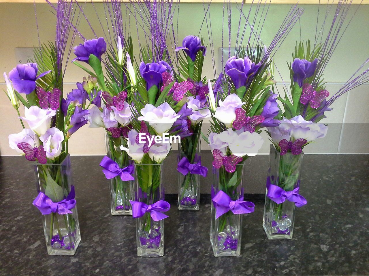 Flower vases on table