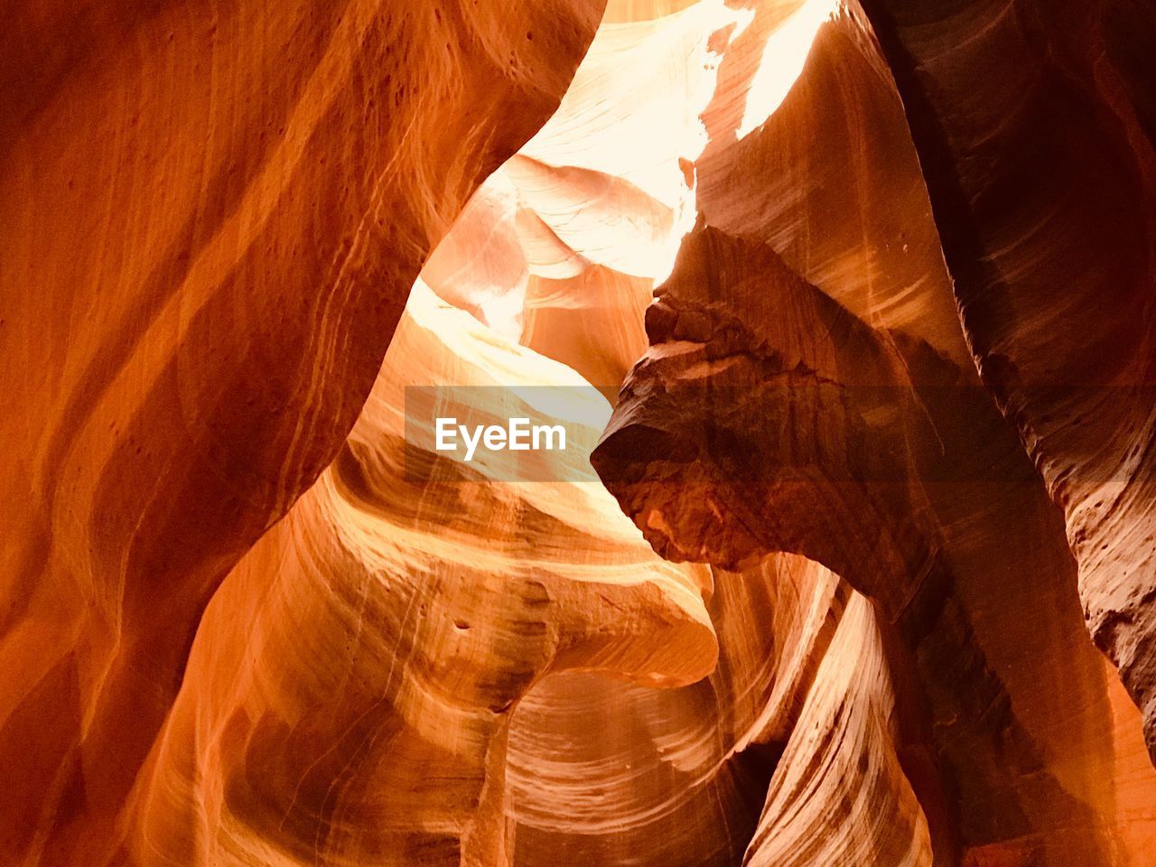 LOW ANGLE VIEW OF ROCK FORMATION IN SUNLIGHT