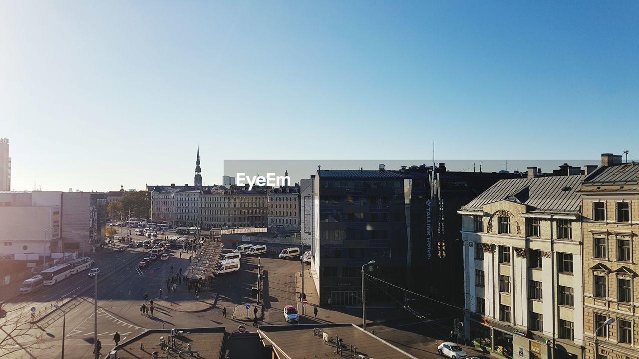 Cityscape against clear blue sky