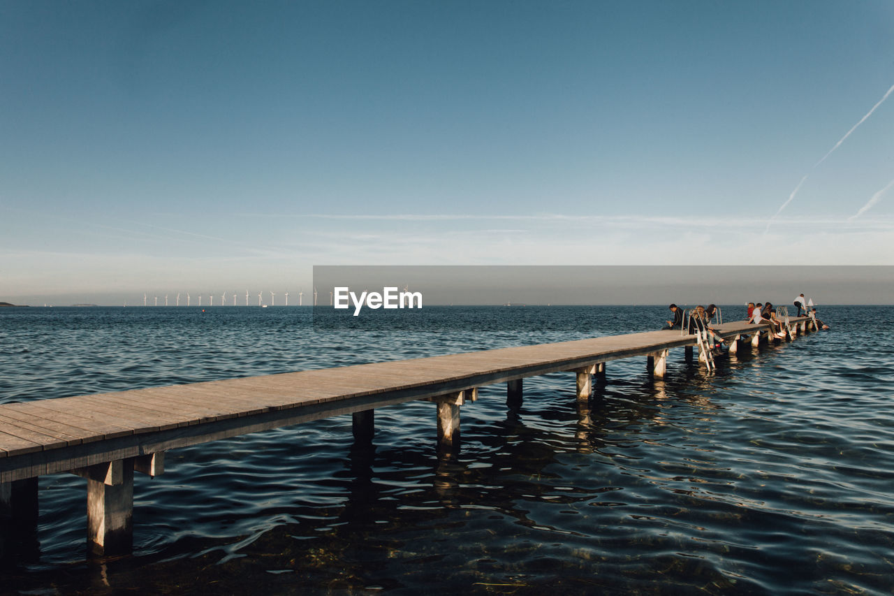 Pier over sea against sky