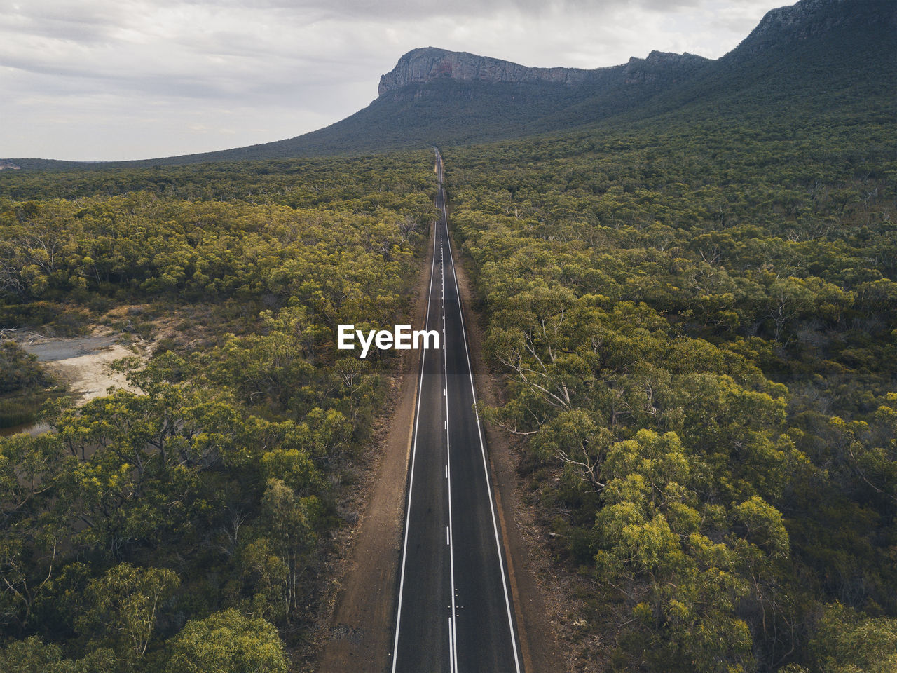 Aerial endless road towards mountains at the grampian national park, victoria, australia