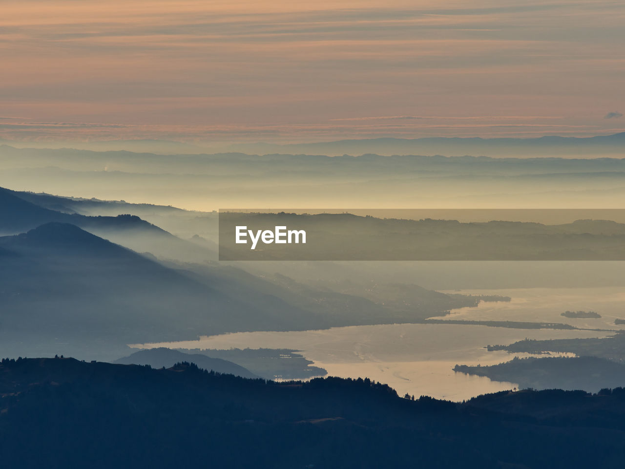 Idyllic view of lake on a foggy autumn evening