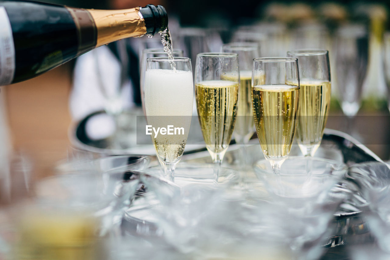 Pouring and serving champagne in a luxury social events like weddings and party.