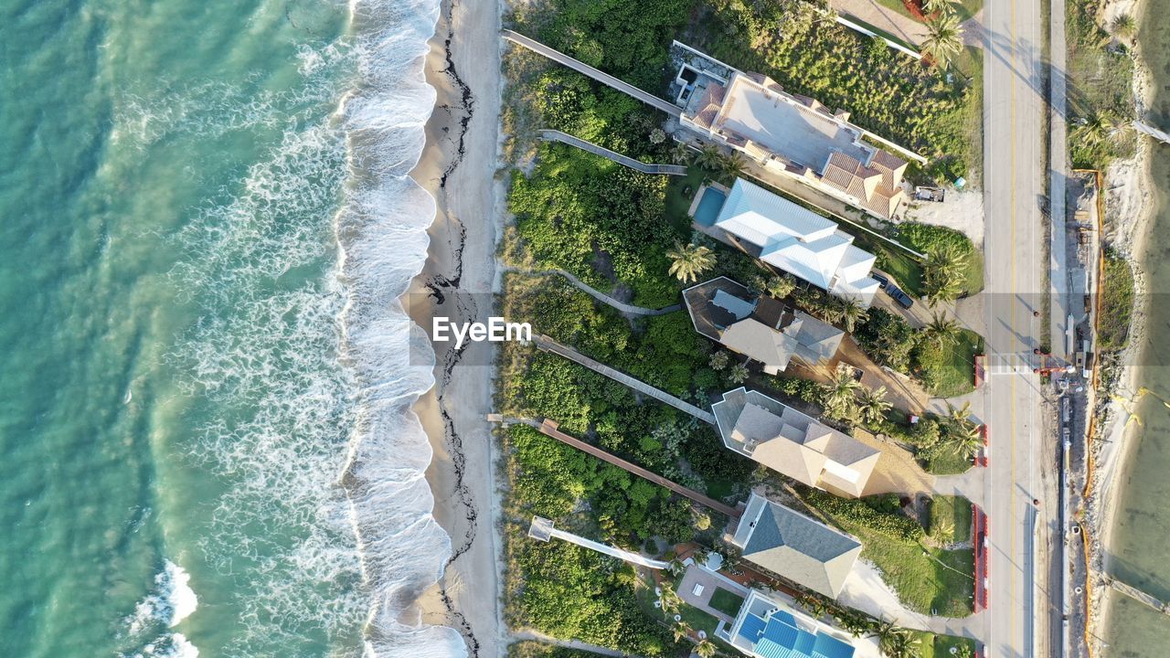 HIGH ANGLE VIEW OF SWIMMING POOL ON BEACH