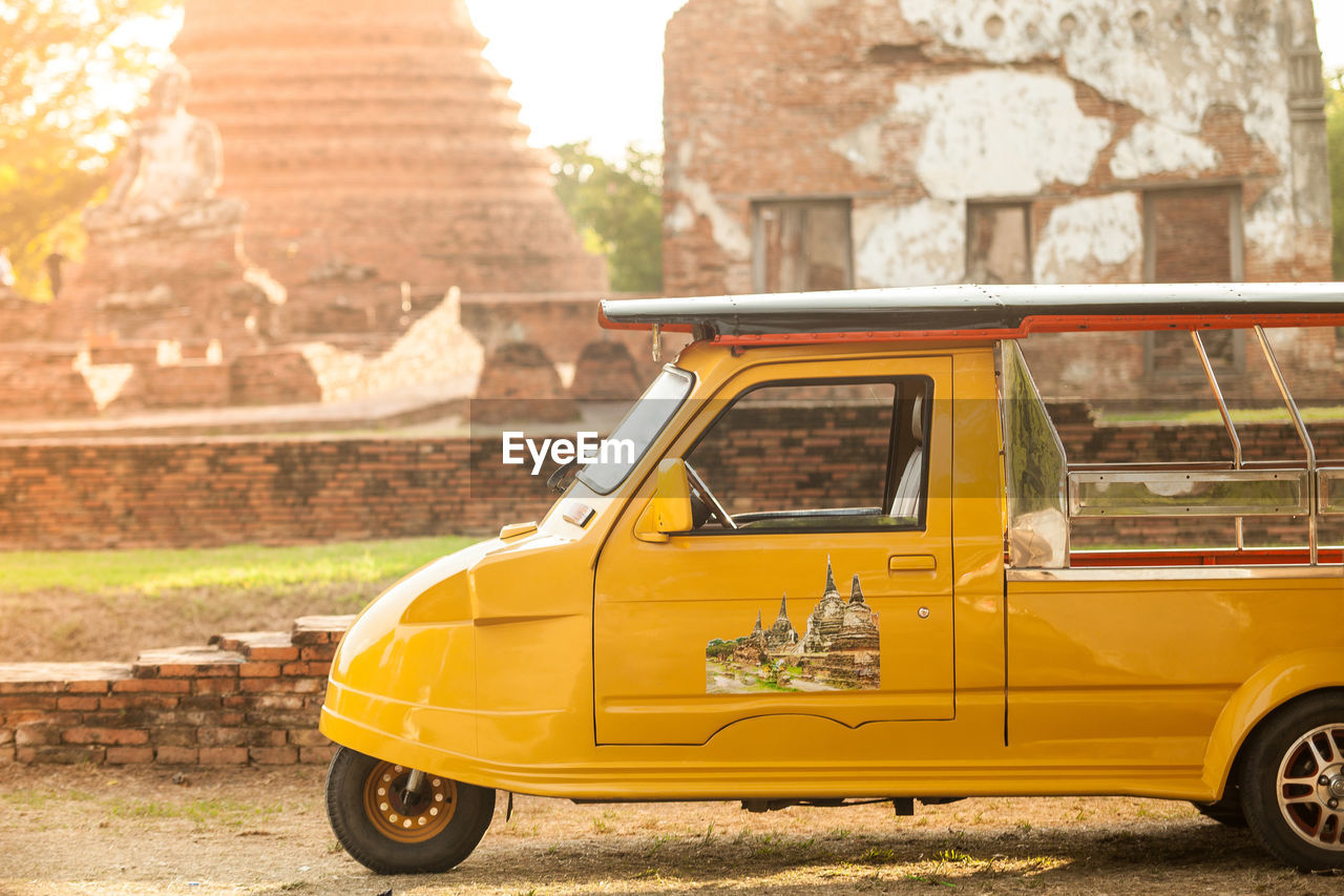 Yellow vehicle parked on field
