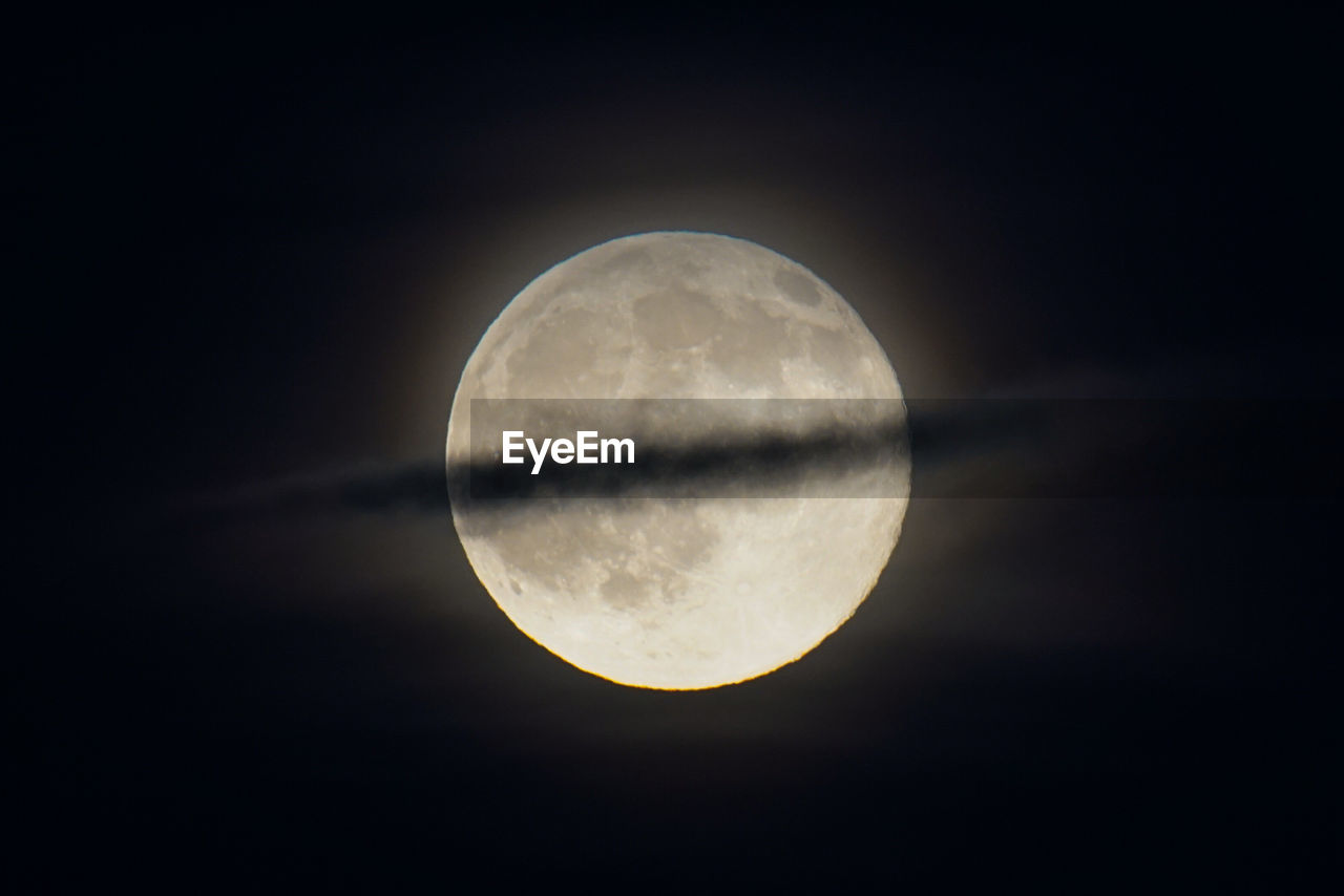 Low angle view of moon against sky at night