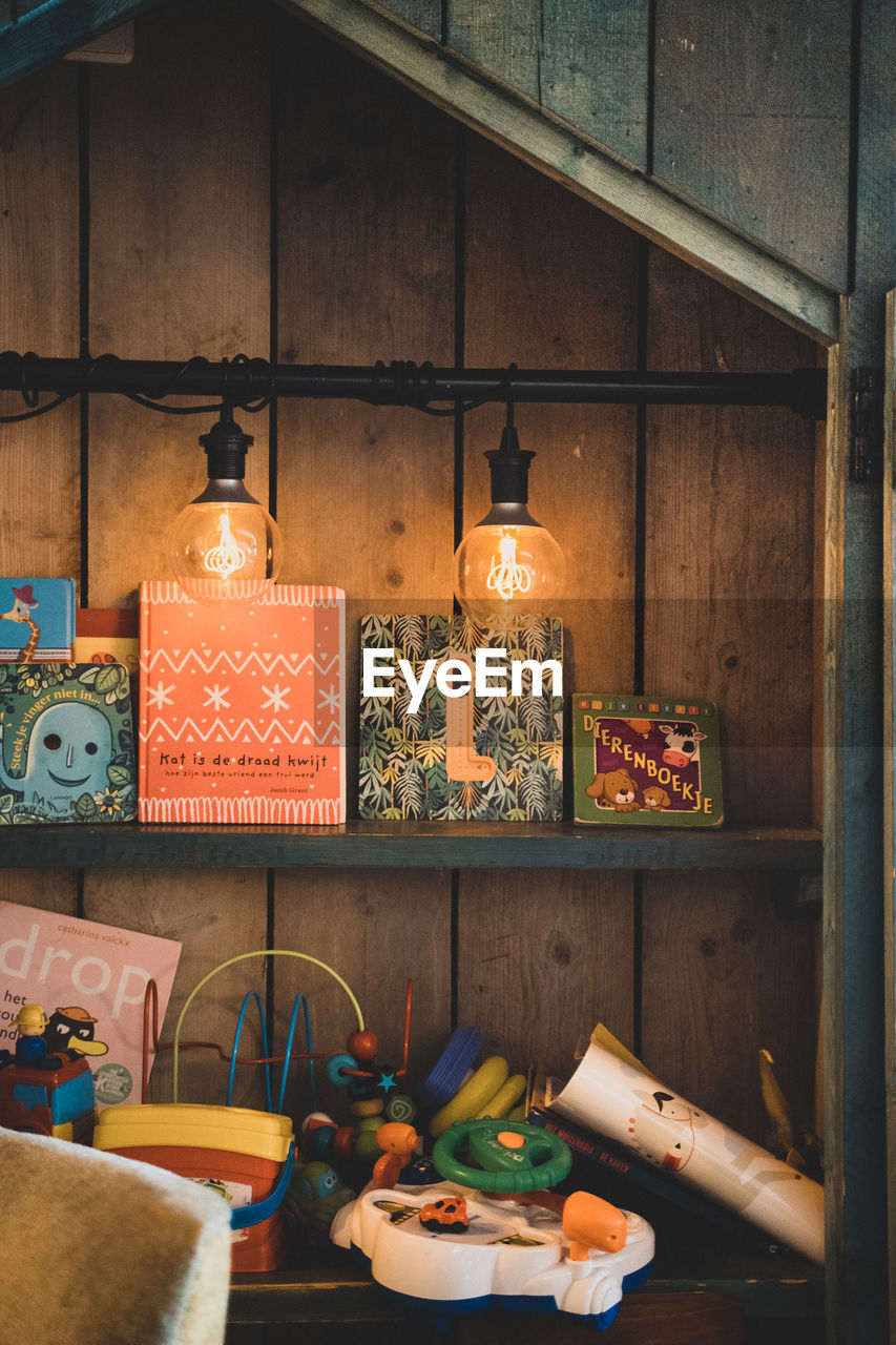 ILLUMINATED LAMPS ON SHELF