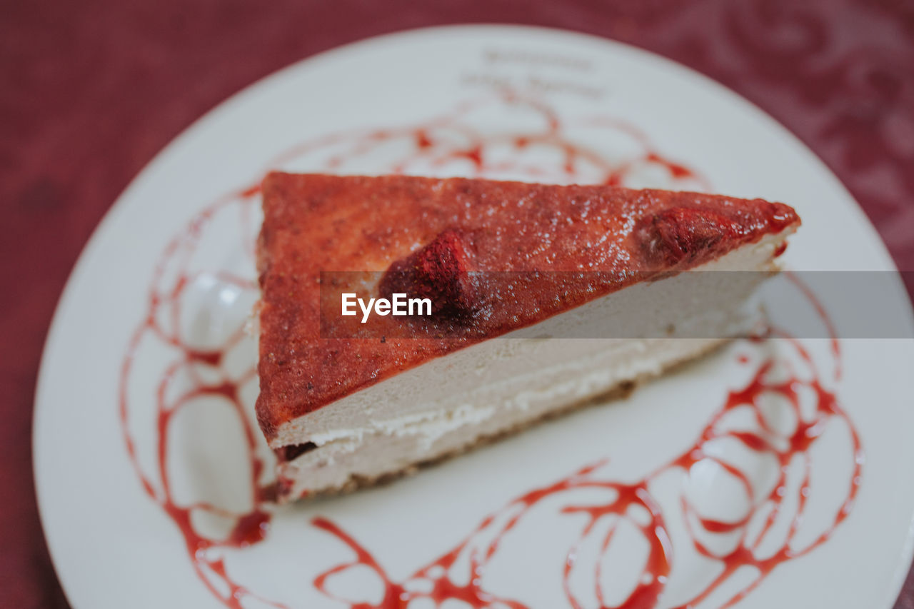 CLOSE-UP OF CAKE SLICE IN PLATE WITH FORK