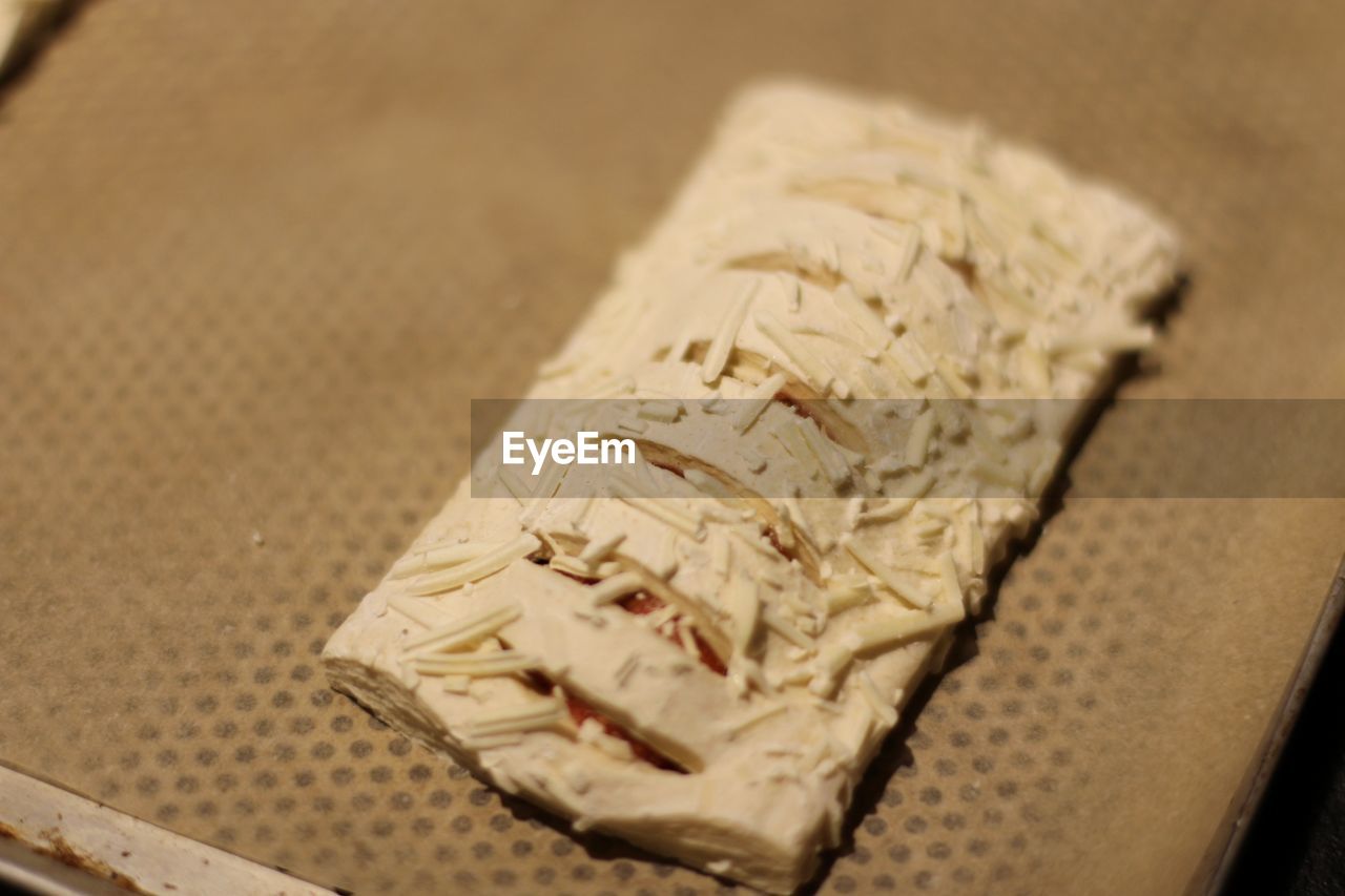 HIGH ANGLE VIEW OF BREAD ON PAPER