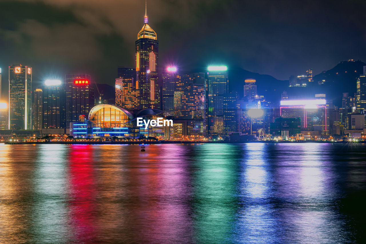 ILLUMINATED BUILDINGS AT WATERFRONT