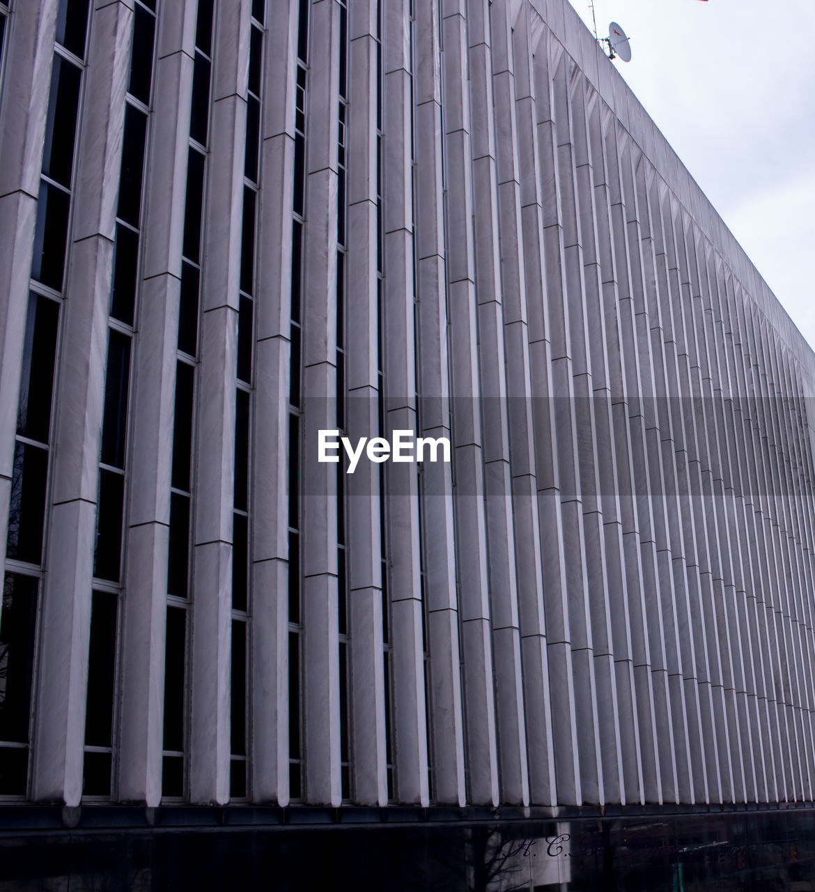 LOW ANGLE VIEW OF BUILDING WITH WINDOWS