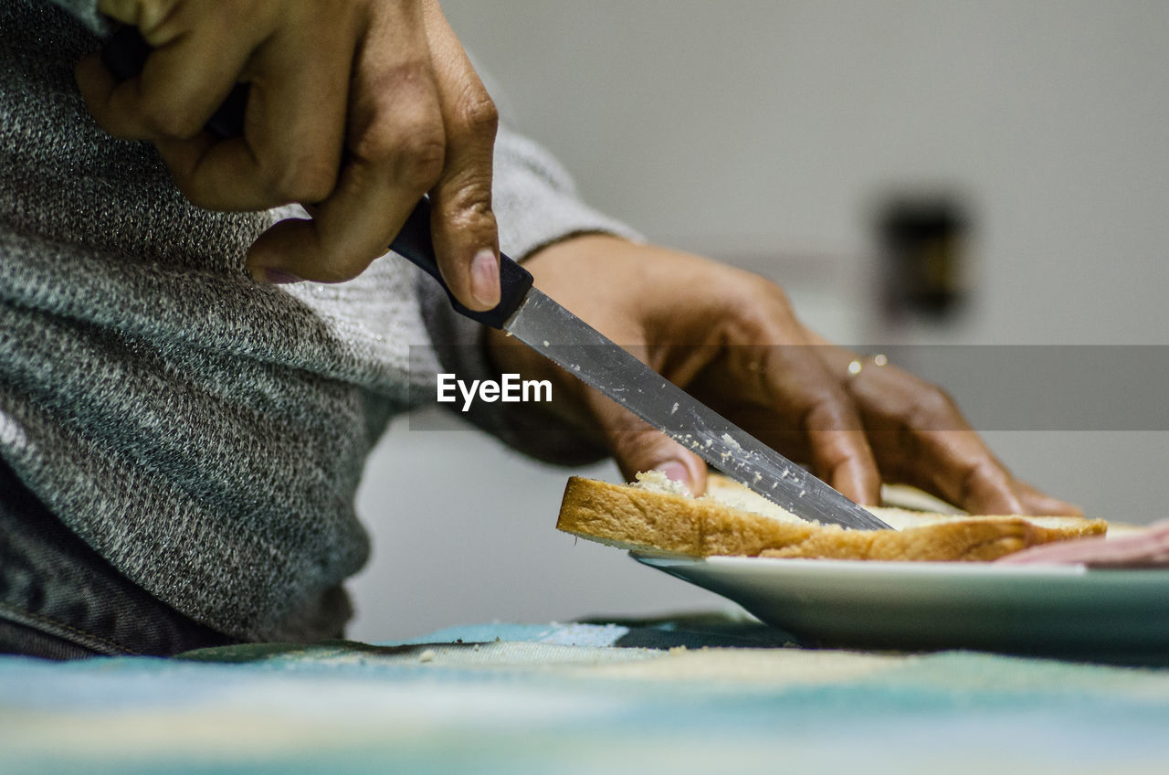 Close-up of woman preparing food