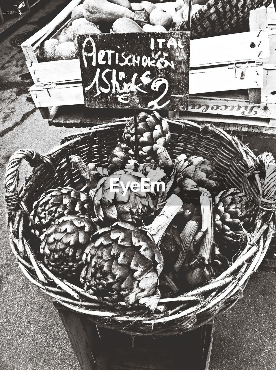 Elevated view of basket of artichokes on market