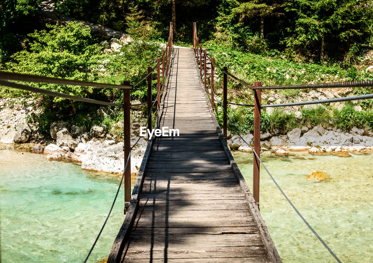 FOOTBRIDGE LEADING TOWARDS FOREST