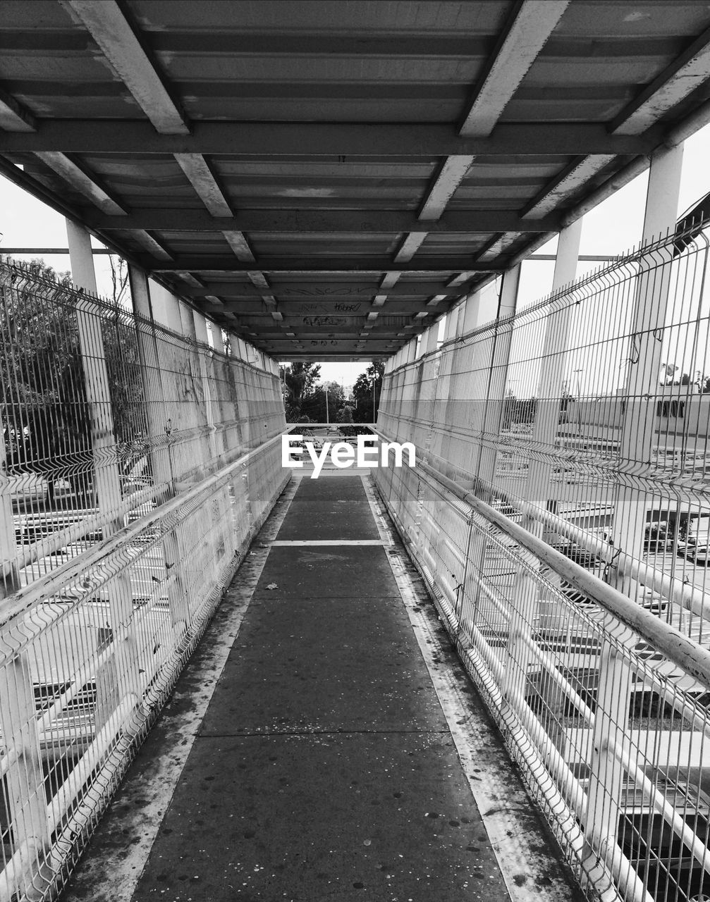 VIEW OF BRIDGE WITH BUILDINGS IN BACKGROUND