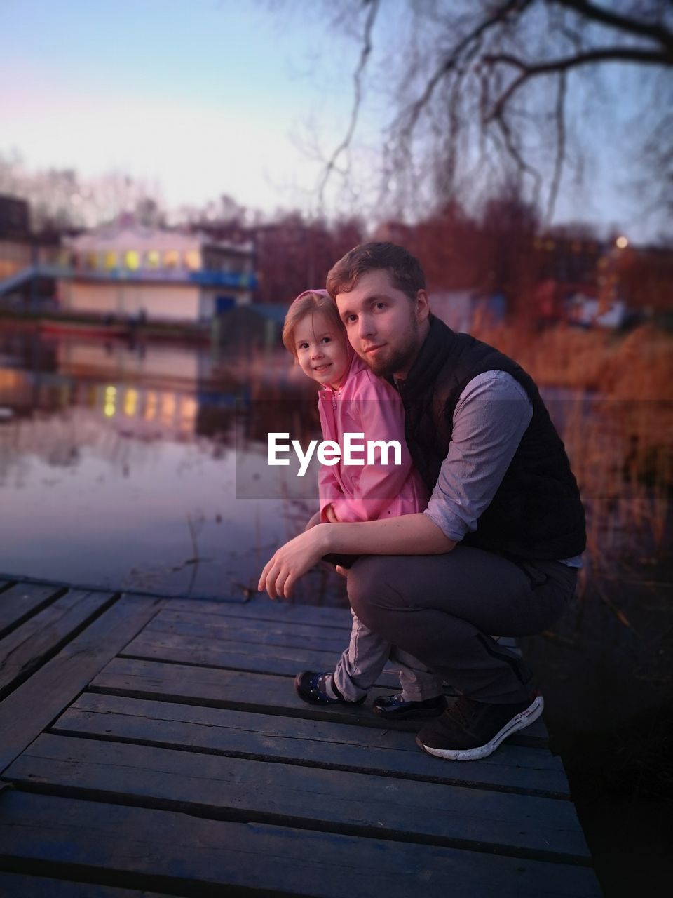 Father and daughter on the river