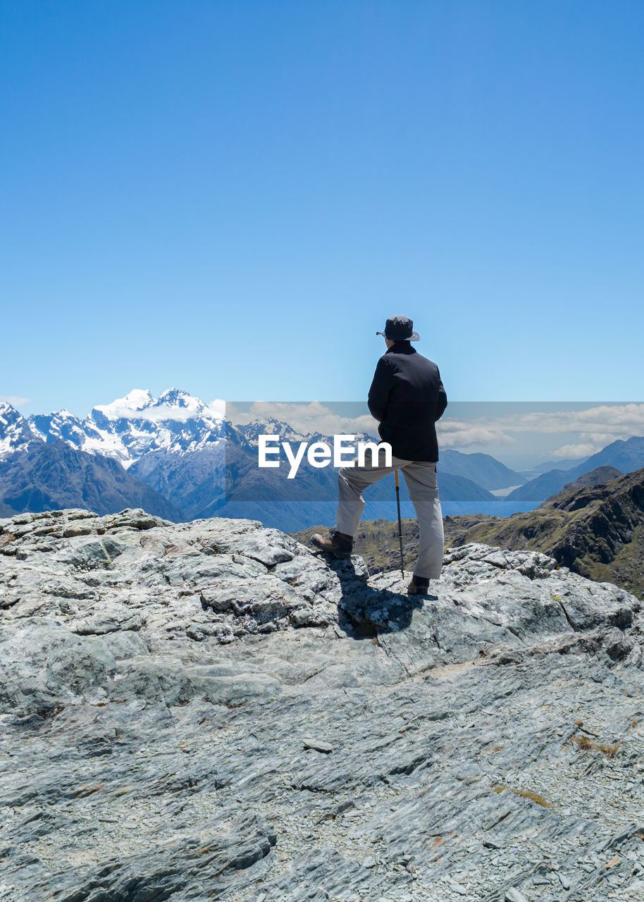 Standing on top of conical hill, view of hollyford valley and tasman sea, routeburn track