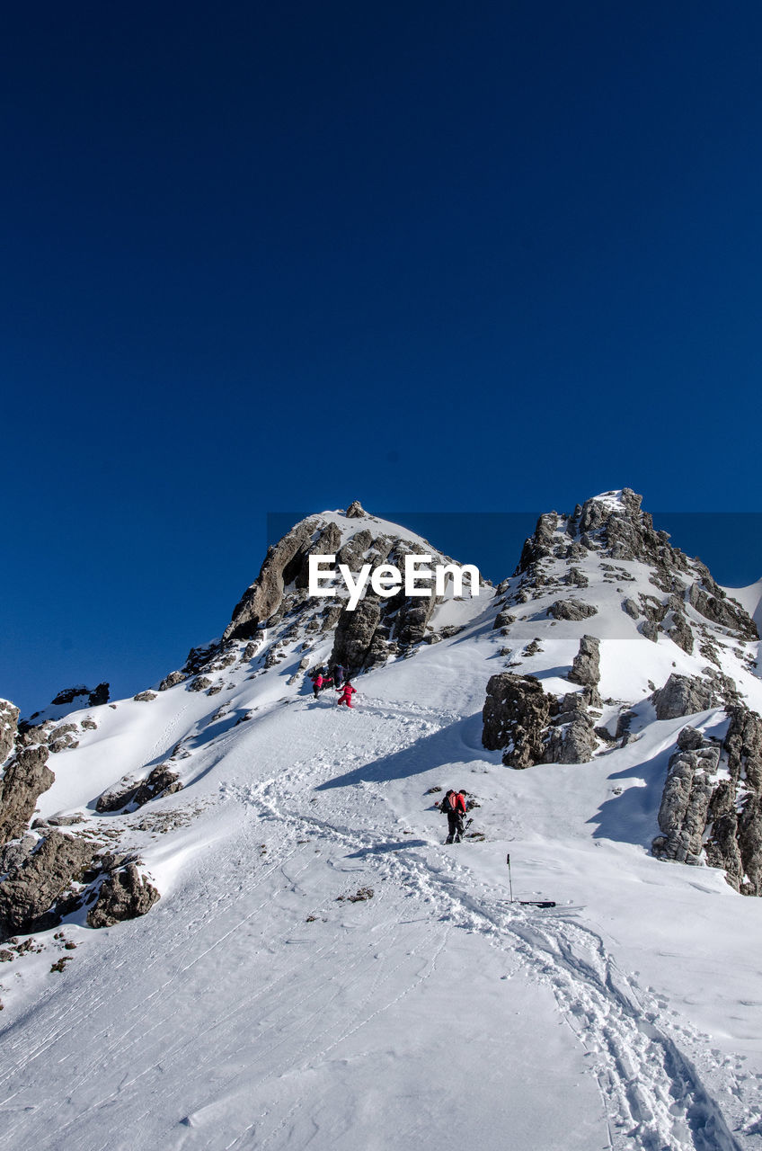 LOW ANGLE VIEW OF MOUNTAIN AGAINST CLEAR SKY